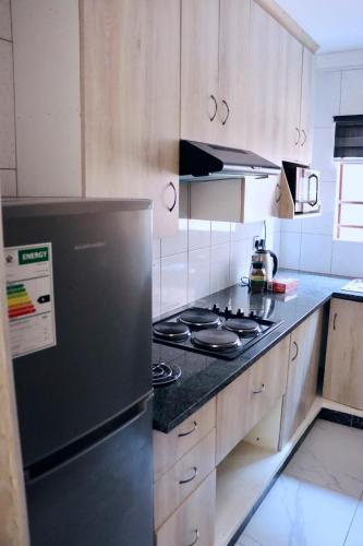 Kitchen, Divine Rest Apartments in Jwaneng