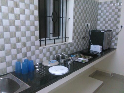 Kitchen, JP Nivaas Guest House in Mayiladuthurai