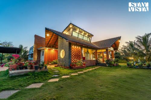 . StayVista at Vafa Acres with BBQ & Jacuzzi