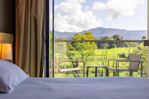 Double or Twin Room with Balcony and Mountain View