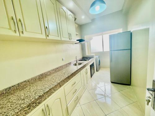 Kitchen, Charming & Simple Flat with Pure Comfort in agadir City in Al Mohammadi