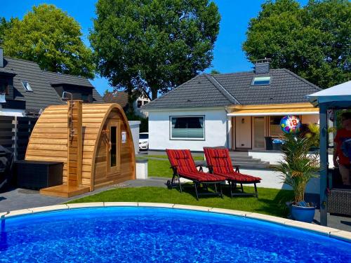 Luxuriöses Ferienhaus Anita mit Pool und Sauna nahe Timmendorfer Strand, Travemünde und Lübeck – khách sạn tại Ratekau