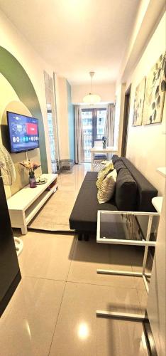 Cozy 1BR at Fame Residences - Near MRT Stations and Malls, with Pool and Amenities in Gloria