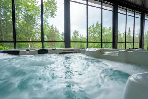 New Construction - Spa & Pool Table - Le Foresti in Saint-Alphonse-Rodriguez (QC)