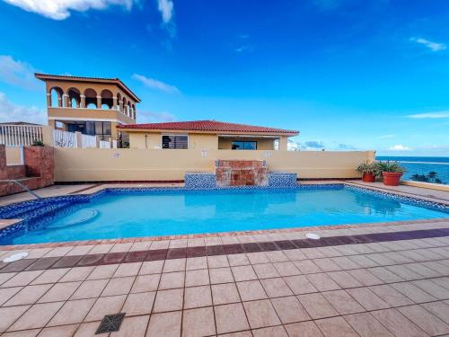 Your Ocean View Oasis in Palmas Del Mar with Pool Access in Humacao