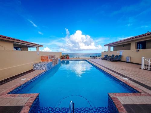 Your Ocean View Oasis in Palmas Del Mar with Pool Access in Humacao