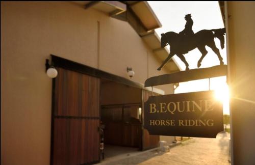 B. Equine Range Hotel