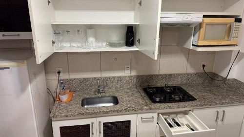 Kitchen, Condominio Nautico Flat Service in Parque Termas de Caldas