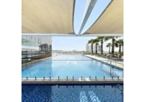 Yogi – Studio With Pool & Balcony | Damac Hills - Dubai