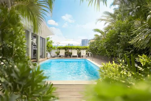 泳池, M Village Hotel Premier Thi Sách, a brand of Modern Village Lifestyle in 胡志明市