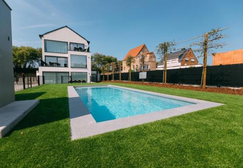 Stylish apartment in De Haan with Pool and garage - image 2