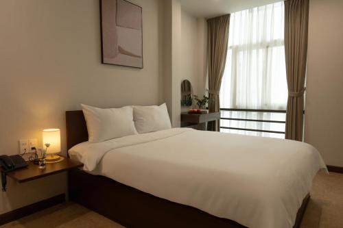Łóżko, Beige Hotel in Ho Chi Minh