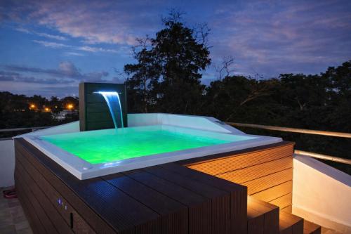 Modern Penthouse with Rooftop Oasis & Gated Parking - 3 in Playa Dorada