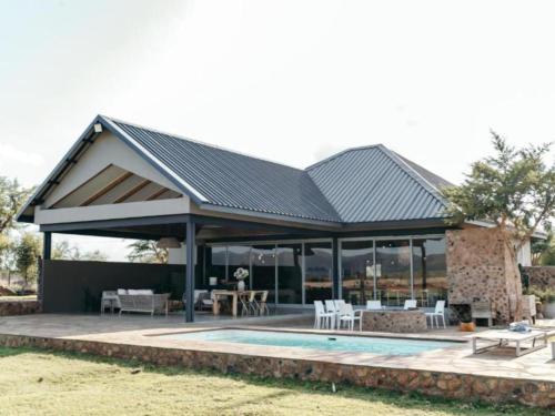 Skats, Stroomrivier Lodge in Koster
