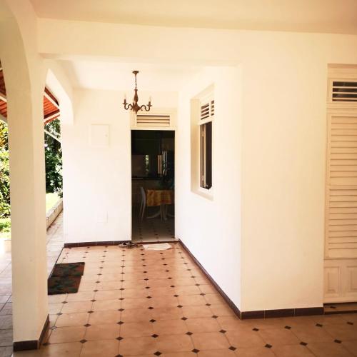 parveke/terassi, Villa de campagne cosy au cœur d un jardin tropicale à 10min de aéroport (Villa de campagne cosy au cœur d un jardin tropicale a 10min de aeroport) in Ducos