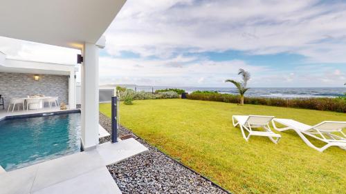 Palvelut, AQUAWAVES - Villa VAGUELIS 6 à 8 personnes - Front de Mer au Moule - vue Désirade & Surf (AQUAWAVES - Villa VAGUELIS 6 a 8 personnes - Front de Mer au Moule - vue Desirade & Surf) in Le Moule