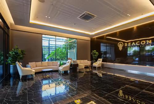 Shared lounge/TV area, Beacon Executive Suites near LK Western Food