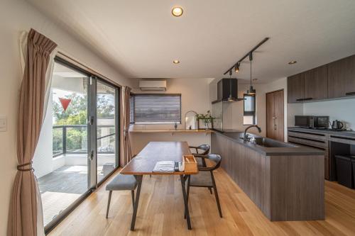 Kitchen, LAGUNA OKINAWA Beachfront YAKA in Kin