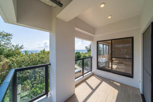 Balcony/terrace, LAGUNA OKINAWA Beachfront YAKA in Kin