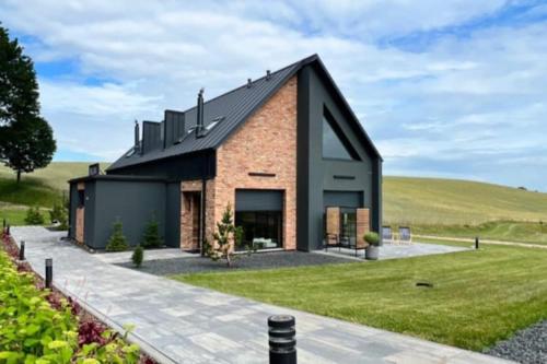 Зовнішній вигляд готелю, Holiday home, bedroom with bathtub, jacuzzi in Коцержина