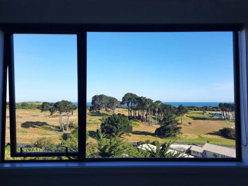 View, New modern home with ocean and golf course views in South Dunedin