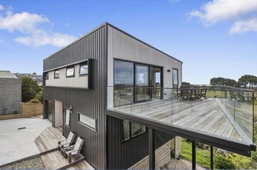 Exterior view, New modern home with ocean and golf course views in South Dunedin