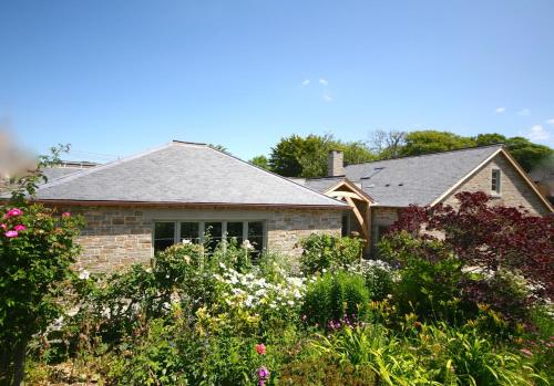 Putsborough Manor 3 Self Catering Cottages with Beach a short walk dog friendly all year, On site Tennis, Play Area, Paddock, Spa baths, BBQ, Private Gardens, Superfast WIFI