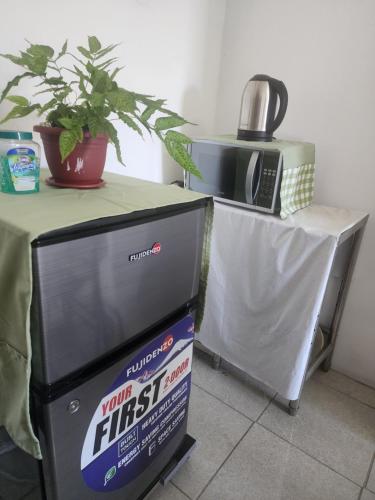 Caishen Apartelle The Couples Getaway - 주방