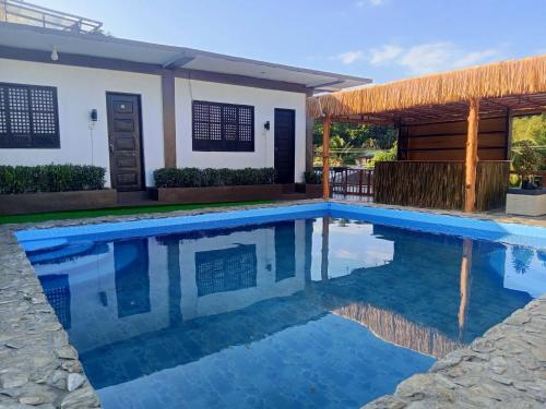 Swimming pool, V Hostel Galera - Quad Room in Puerto Galera
