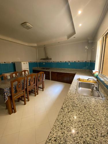 Spacious 3-Bedroom Apartment with Terrace & Free Parking at Hay El Houda in El Houda