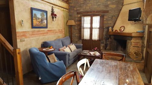 Koplietošanas atpūtas telpa ar TV, Apartamentos La Borda Castillon in Tierrantona