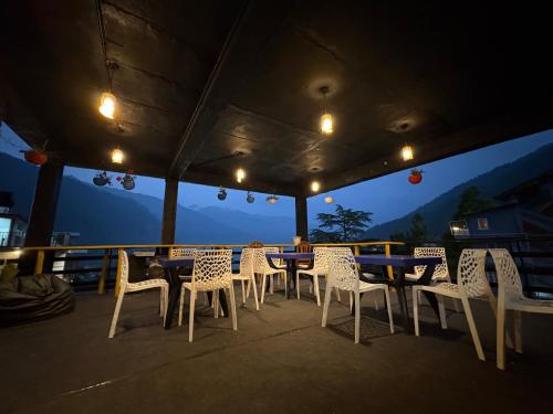 Exterior view of New Suraj Inn - Nestled near Hadimba Temple ! Rooftop Cafe ! Private Parking