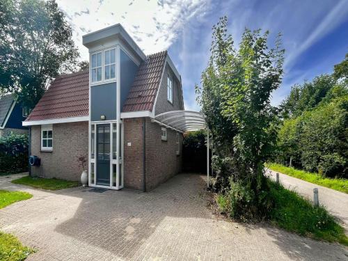 Exterior view, Villa with Expansive Sunny Garden in Wimmenum