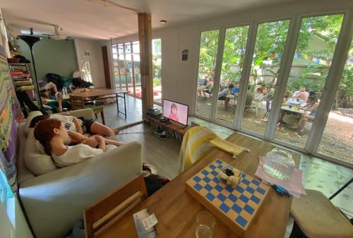 Shared lounge/TV area, The Yard Hostel Bangkok in Chatuchak