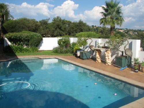 Swimming pool, Chez Esme Guest House in Roodepoort