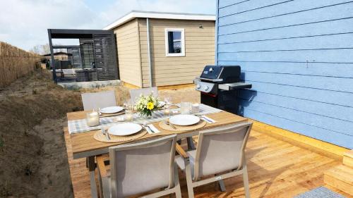 grădină, Ferienhaus Deichkoje - ANKERPLATZ DAHME, Haus in Dünengelände, Strandkorb, Gasgrill, WLAN (Ferienhaus Deichkoje - ANKERPLATZ DAHME, Haus in Dunengelande, Strandkorb, Gasgrill, WLAN) in Dahme