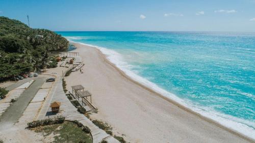 Villa Valencia - Tu Refugio con AC y Cocina tras un Dia de Playa in Los Patos