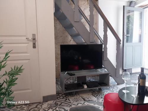 Koplietošanas atpūtas telpa ar TV, Gîte Tour du Rocher (Gite Tour du Rocher) in Luzech
