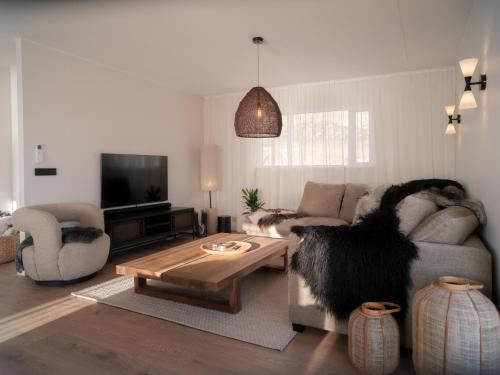 Waterfall Villa - Black Beach & Fjord Views in Karlsstaðir