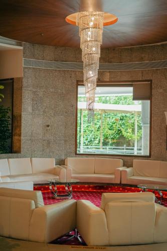 Shared lounge/TV area, HOTEL PENINSULA GRAND in Kurla
