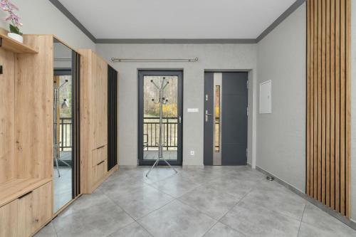 Sunny Apartment with Parking Jacuzzi Sauna & Balcony with Mountain View by Noclegi Renters - image 4