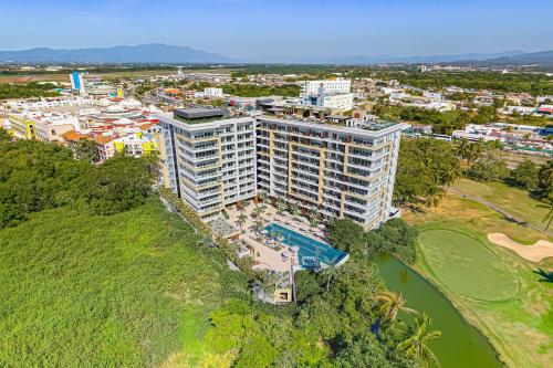 Enchanting & modern beach retreat with pool, gym, & breathtaking balcony views