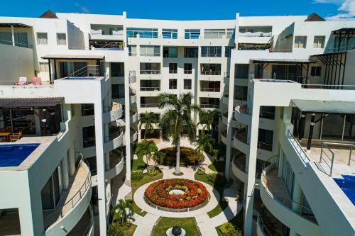 Modern ocean-view stay with pool and rooftop access, large balcony, and AC