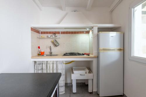 Kitchen, Antico Trullo Pasquale con piscina in Sorbola