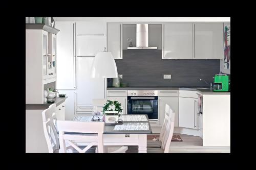 virtuve, Ferienhaus Nanny Und Helene in Uphusum