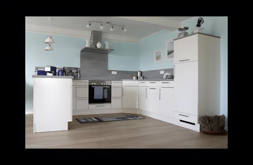 virtuve, Ferienhaus Nanny Und Helene in Uphusum