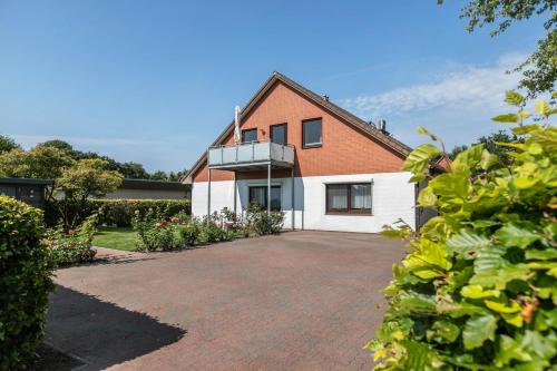 Фасада на хотела, Ferienwohnung Mühlenweide (Ferienwohnung Muhlenweide) in Wesselburen