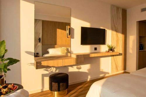 Cavo Maris Beach Hotel - Tap to explore photos