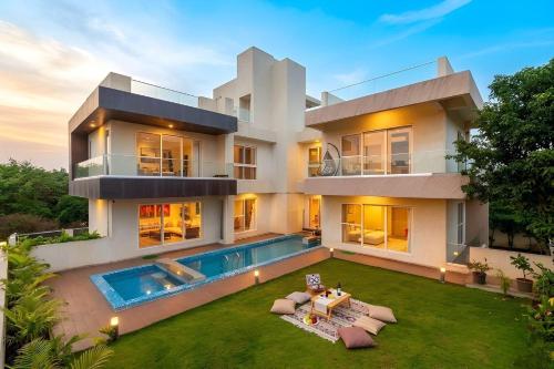 Exterior view of Villa Azul by StayVista, offering A snooker table, Terrace, Swimming pool & A spacious lawn with a c