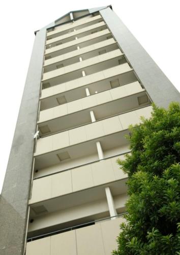 a tall building with a large clock on top, Urban Hotel Twins Chofu in Chofu